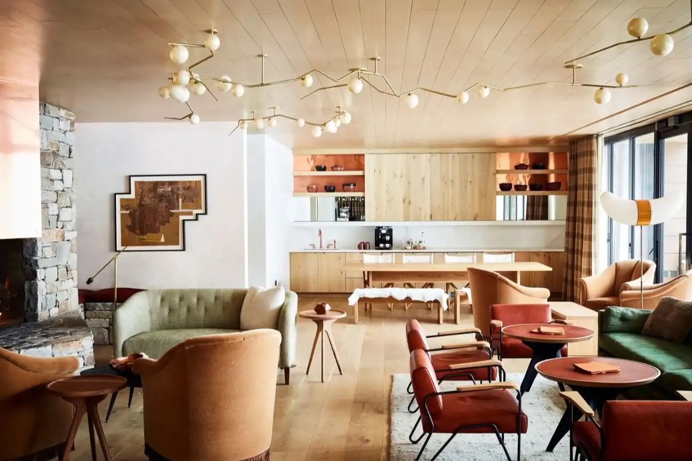 Contemporary living area with leather furnishings and stone fireplace
